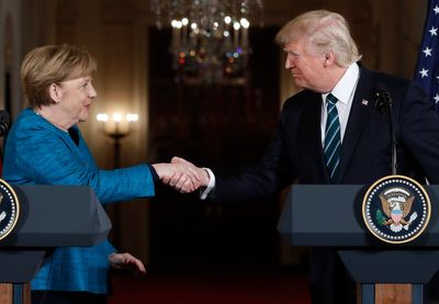 German ex-leader Merkel says she felt sorrow at Trump's comeback and recalls awkward non-handshake