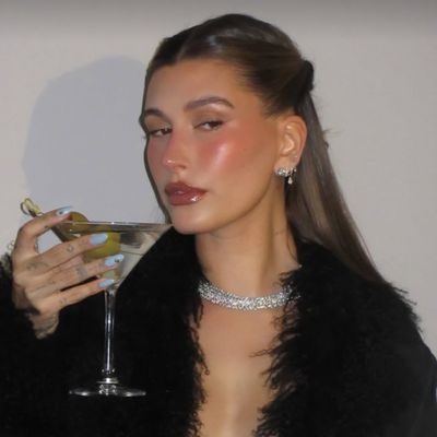 Hailey Bieber Turns 28 in an Opulent Feather Top and a Martini Manicure