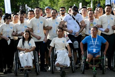 Survivors, Sniffing Dogs Join Anti-mine March At Cambodia's Angkor Wat