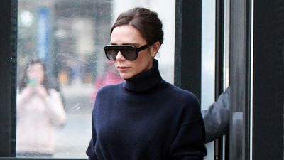 Eye-catching burgundy boots give Victoria Beckham's navy roll neck jumper and relaxed jeans a seriously cool edge