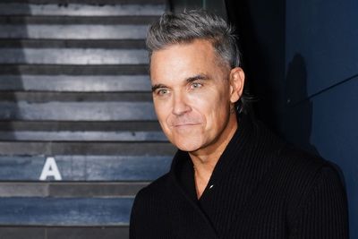 Robbie Williams' biopic lost 'millions of pounds' due to Queen Elizabeth's death