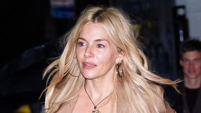 Sienna Miller's wide leg suit and striking brown boots are smart casual winter dressing at its very best