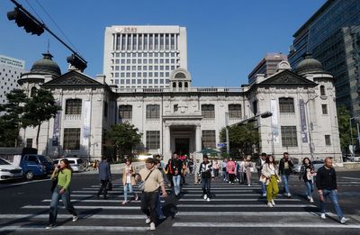 South Korea's central bank cuts a key rate to nurse a slower economy