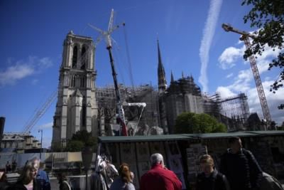 President Macron Pays Tribute To Historic Notre Dame Statue