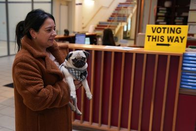 In Pictures: Voters and a pug cast their ballots in the Irish General Election