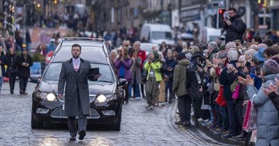 Hundreds pay final farewell to Janey Godley as hearse showered with roses