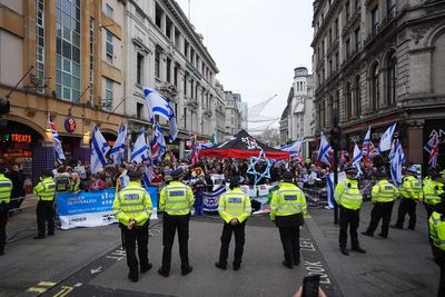 Pro-Palestine group and counter-protesters demonstrate near Christmas shoppers