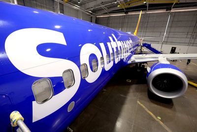 Southwest Airlines says it is ending cabin service earlier due to injury risk