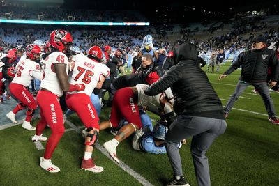 Brawl breaks out as NC State attempts to plant flag on North Carolina logo