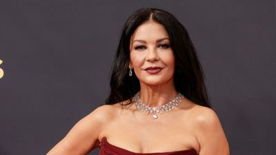 Catherine Zeta-Jones's luxe entryway flooring material is 'a breathtaking introduction to her home' – her high gloss look is bold, but it pays off