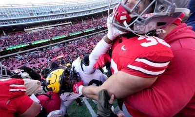 Police use pepper spray to break up brawl after Michigan stun No 2 Ohio State