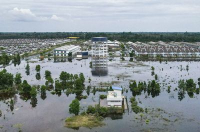 PM says six months of rain fell in five days as floods wreak havoc in Malaysia