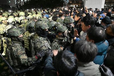 South Korean forces clash with crowds outside parliament after martial law declared