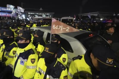 Woman Defies Martial Law, Grapples With Soldier In South Korea