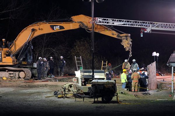 Rescuers search for woman who may have fallen into a sinkhole while looking for her lost cat