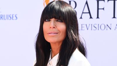 Claudia Winkleman was a snowy vision in white stilettos and satin mini dress that we're surprised is on sale