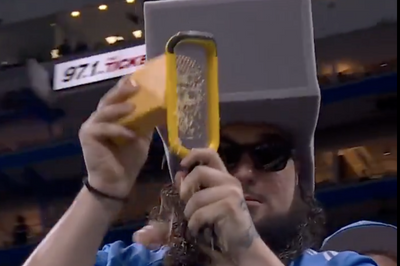 A Lions fan literally grated cheese in the stands to taunt the Packers