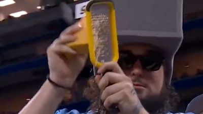 Cheese-Grating Lions Fan Proves Prop Comedy Is Alive and Well