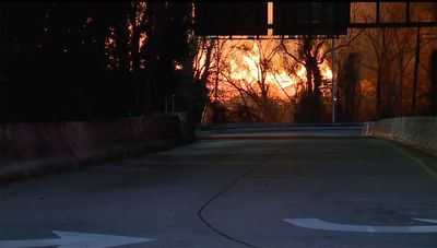 Wind-driven brushfire at Baltimore wood recycling yard closes expressway, light rail, schools