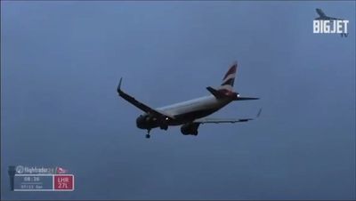 Plane struggles to land at Heathrow Airport as Storm Darragh hits UK with wind speeds reaching 90mph