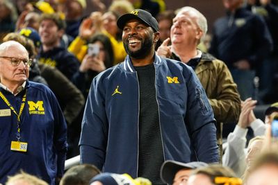 Sherrone Moore fired up Michigan basketball fans by pretending to plant a flag in the stands