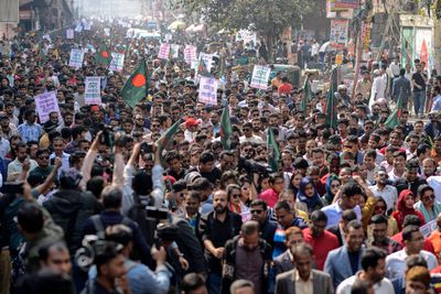 Supporters of Bangladesh Nationalist Party march in protest at attacks in India