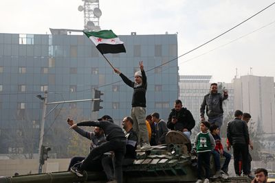 Assad flees Syria, rebels take Damascus