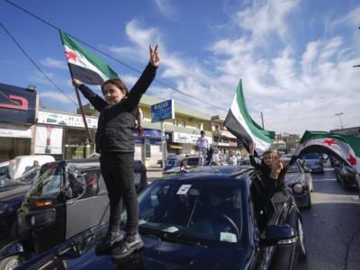 Free Syrian Army Flag Flies Over Damascus As Assad Falls