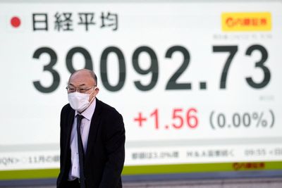 Stock market today: Asian shares slide, with Korean benchmark down 2.5%, after Wall St hits records