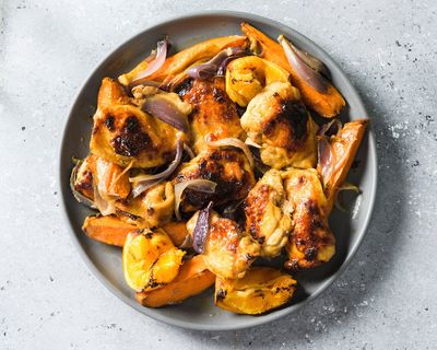 Roasted orange delivers big flavor in this smoky chicken traybake