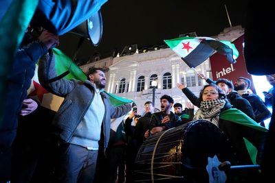 Syrians gather in London's Piccadilly Circus to celebrate fall of Assad regime