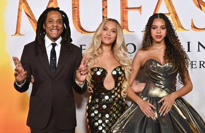 Jay-Z and Beyoncé stand united at premiere with daughter Blue Ivy after rapper is accused of raping 13-year-old girl