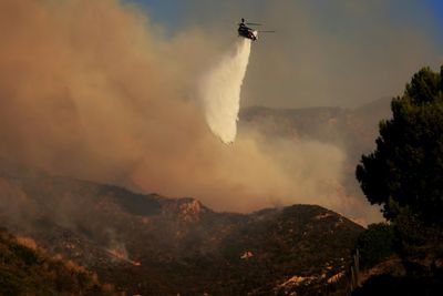 Wildfire In Malibu Destroys Homes, Sends Thousands Fleeing