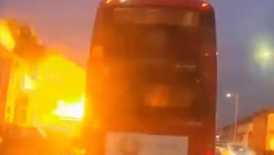 Watch: House explodes into fireball metres away from bus