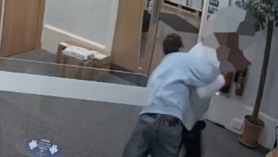 Moment receptionist disarms self-proclaimed Nazi carrying six-inch knife