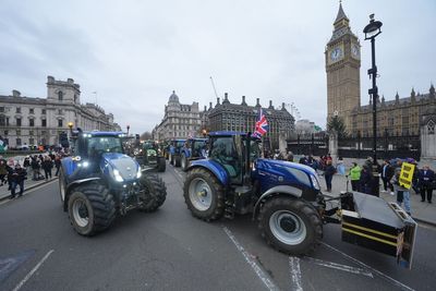 Farm tax changes under fire in Parliament as angry farmers protest outside