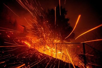 Malibu fire rages as improving weather brings hope for thousands who fled