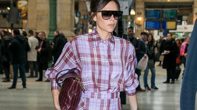 Victoria Beckham's tartan moment with burgundy boots for a March day in Paris is weirdly perfect for December 25th