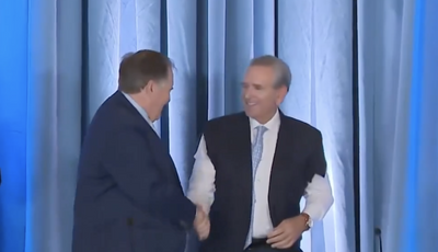 UNC AD Bubba Cunningham welcomed Bill Belichick by donning a suit jacket with cut-off sleeves