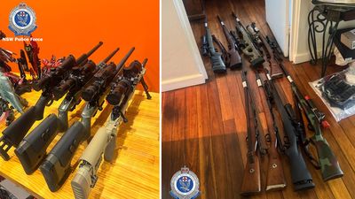 Man charged after police discover firearm stash