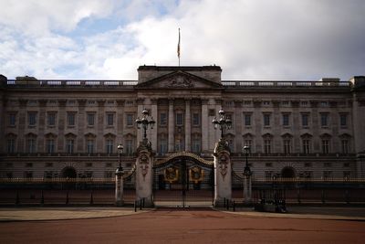 Buckingham Palace says reports of staff member’s arrest will be investigated