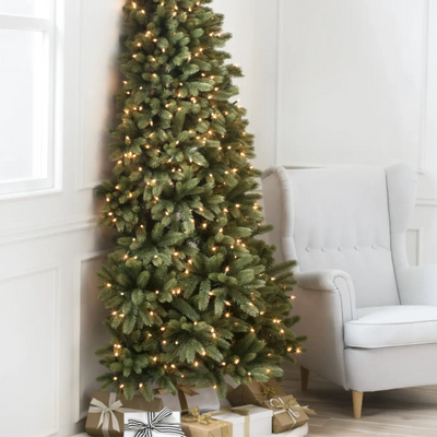 Half Christmas trees are the space-saving trend perfect for your tiny living room - interior experts reveal how to style them at home