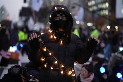 AP Photos: K-pop light sticks take over protests that fueled impeachment of South Korea's president
