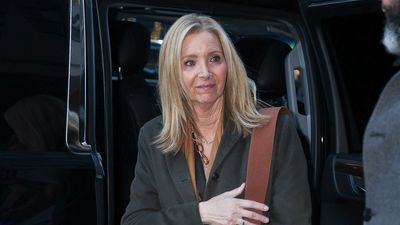 Lisa Kudrow oozes sophistication in a luxurious khaki maxi coat and brown leather accessories