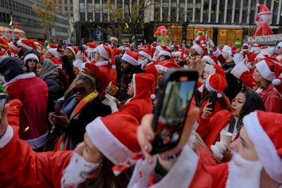 Thousands of Santas and a few Grinches hit the streets for annual SantaCon bar crawls