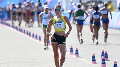 Olympian shrugs off early blow to take race walk title