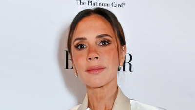 Victoria Beckham just wore a stunning jewel-toned satin midi dress and matching heels - her unexpected peppermint-coloured accessory is so chic