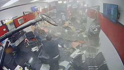 Moment SUV slams into Houston barber shop injuring a 10-year-old boy and other customers