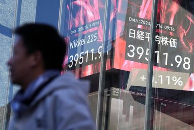 Stock market today: Asian shares are mixed after Nasdaq sets a record ahead of Fed meeting