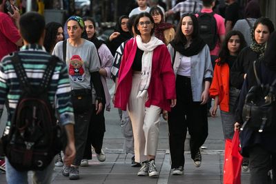 Iran pauses the process to implement a new, stricter headscarf law for women, official says